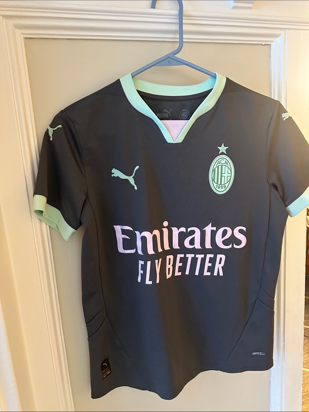 Puma Kids Black Jersey with Mint Trim and Pink Sponsor Print